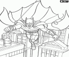 L'home ratpenat, el superheroi Batman es mou per damunt els edificis de Gotham City