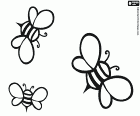 Tres abelles volant. Les abelles són els insectes que produeixen mel